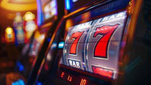 Filipino player spinning slot game reels on a mobile phone browser at Apple Lucky